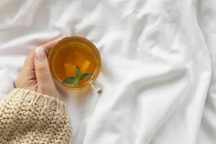 hand-holding-cup-tea-with-mint